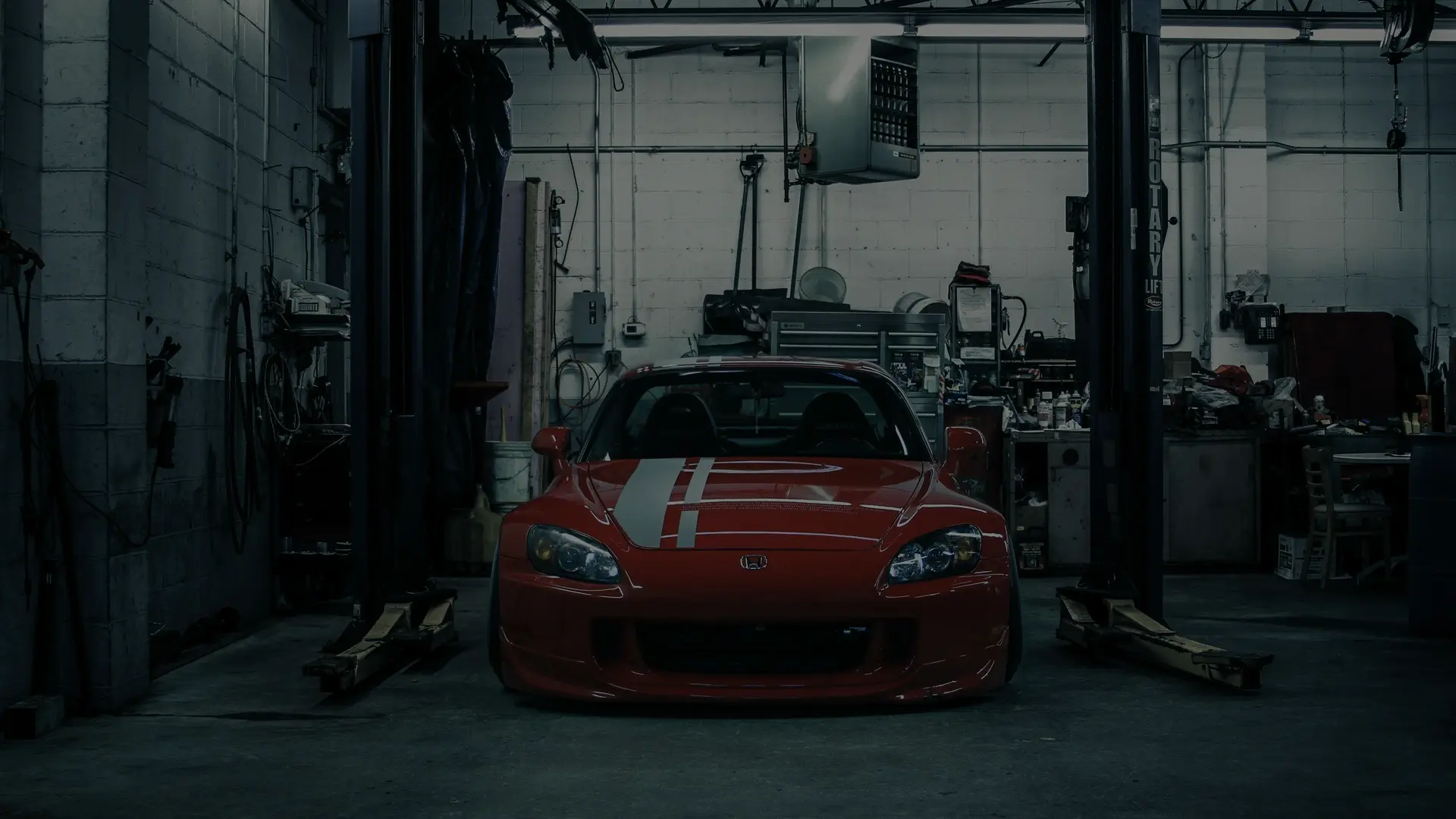 Red performance car in a garage
