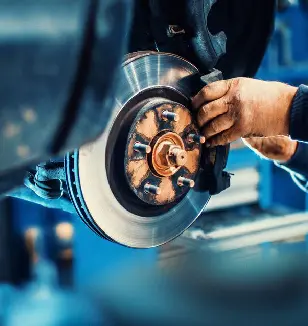 Mechanic inspecting a brake disc and hub